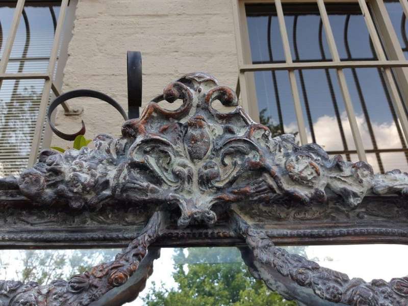 An Ornate Carved & Bevelled Painted Mirror