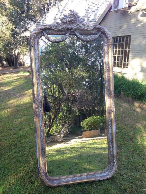 An Ornate Carved & Bevelled Painted Mirror