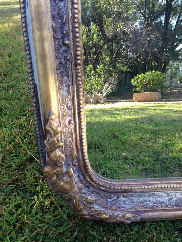 An Ornate Carved & Bevelled Painted Mirror