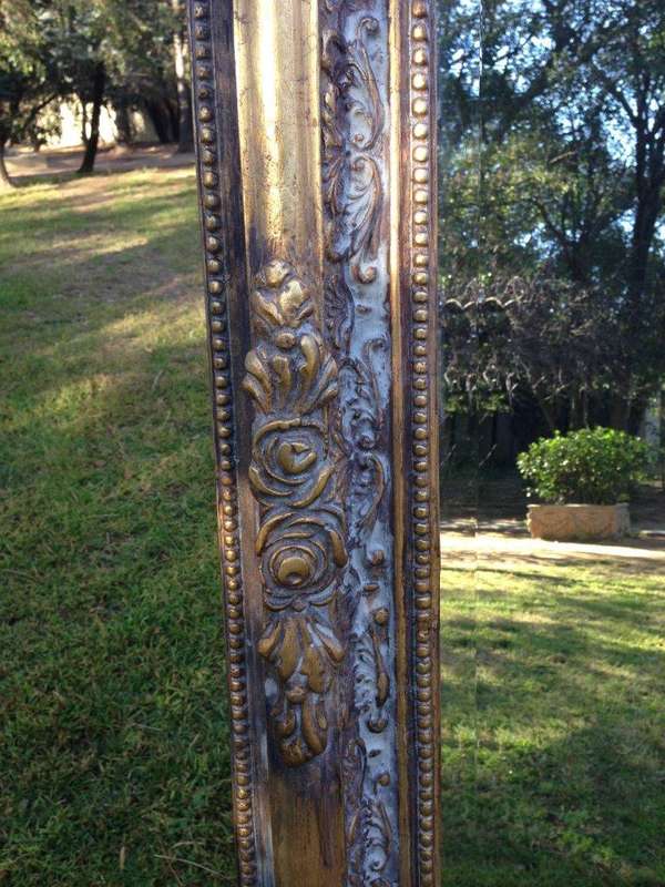 An Ornate Carved & Bevelled Painted Mirror