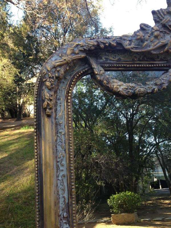 An Ornate Carved & Bevelled Painted Mirror
