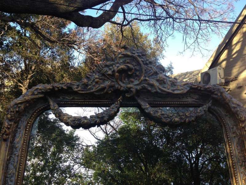 An Ornate Carved & Bevelled Painted Mirror