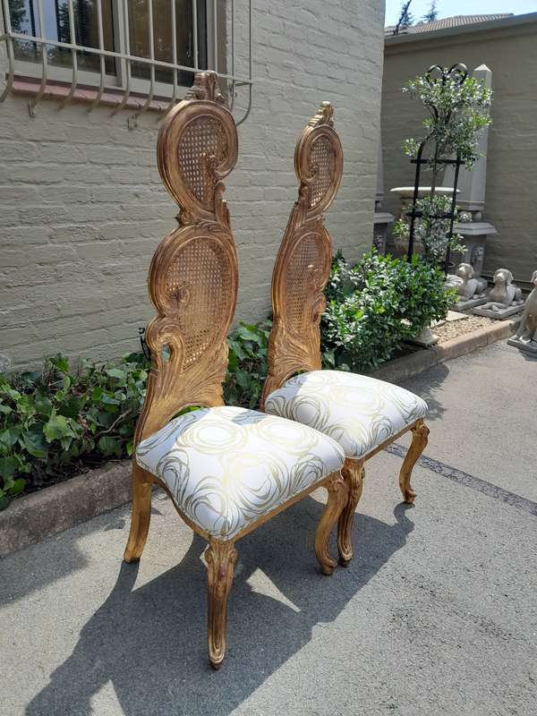 A 20th Century Rare Pair of Baroque Style Carved and Hand Gilded Throne Chairs Upholstered in a C...