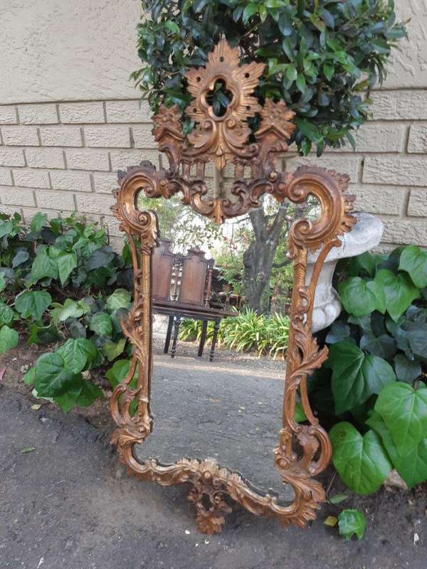 Gilt And Carved Wooden Mirror