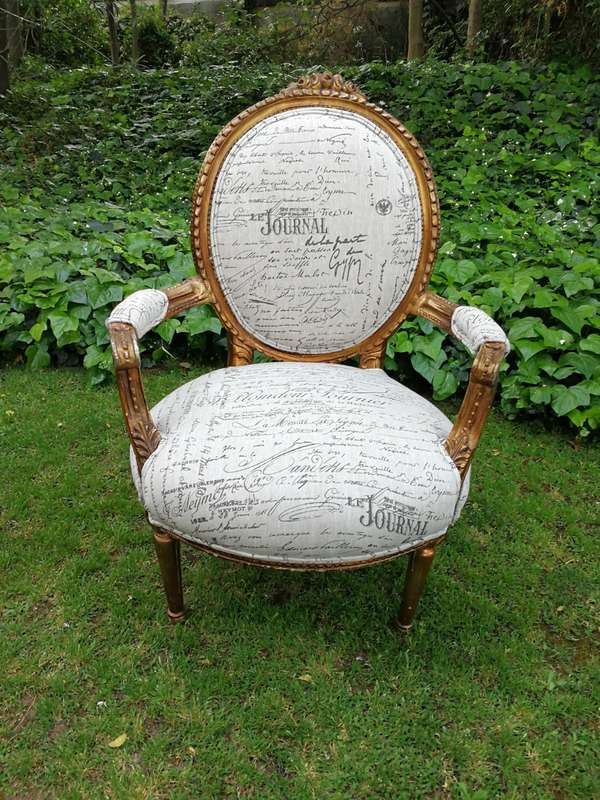 A Pair of French Style Carved and Gilded Armchairs Upholstered in a Custom-made Script on Linen F...