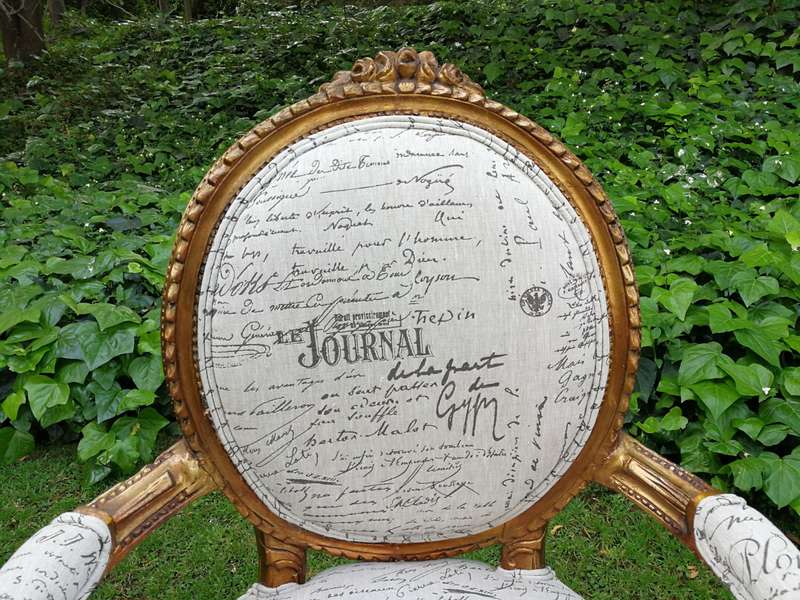 A Pair of French Style Carved and Gilded Armchairs Upholstered in a Custom-made Script on Linen F...