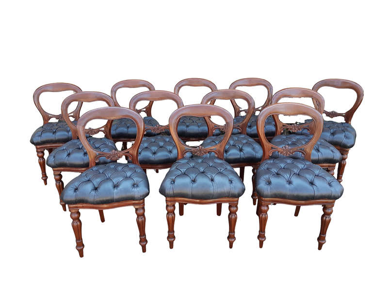 A 20TH Century Set of Twelve Victorian Style Mahogany Bustle Back Dining Chairs Upholstered in De...