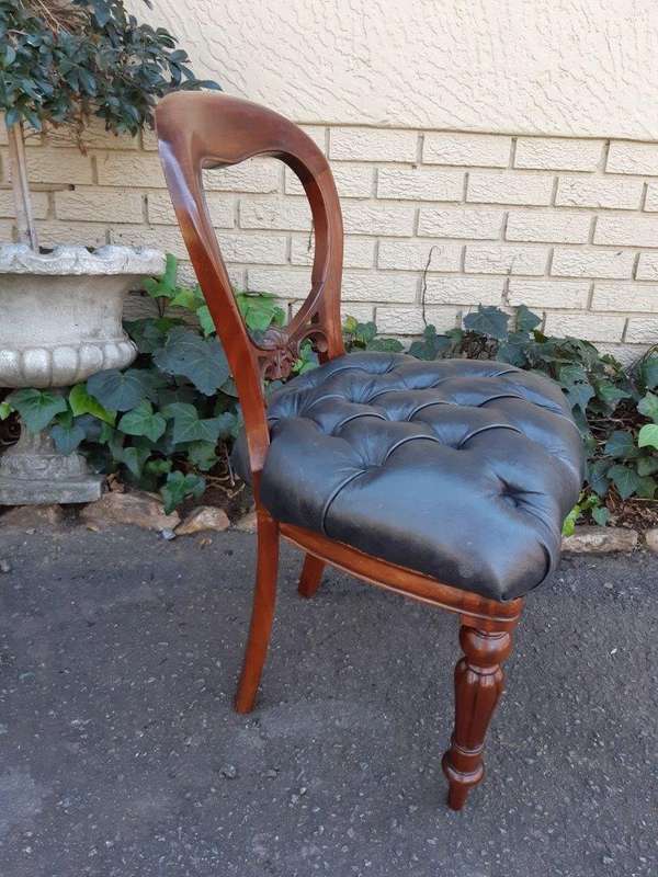 A 20TH Century Set of Twelve Victorian Style Mahogany Bustle Back Dining Chairs Upholstered in De...