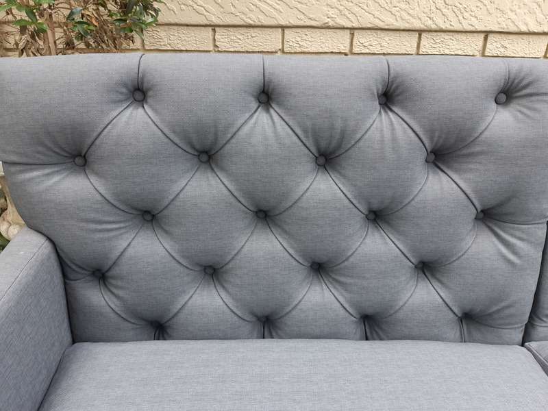 A Designer Sofa in a Grey Imported Waterproof and Stain Resistant Fabric. Condition is as new.