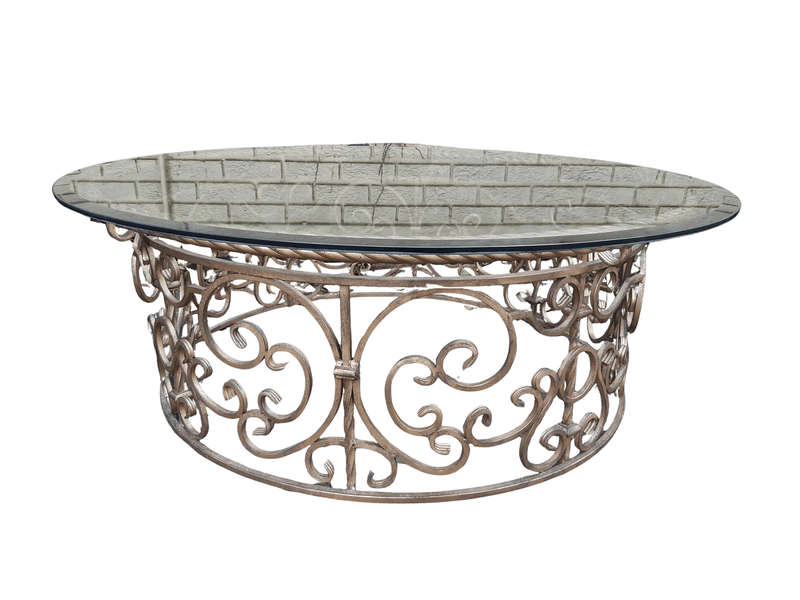 Round wrought iron coffee table with glass top with thick bevelled glass top