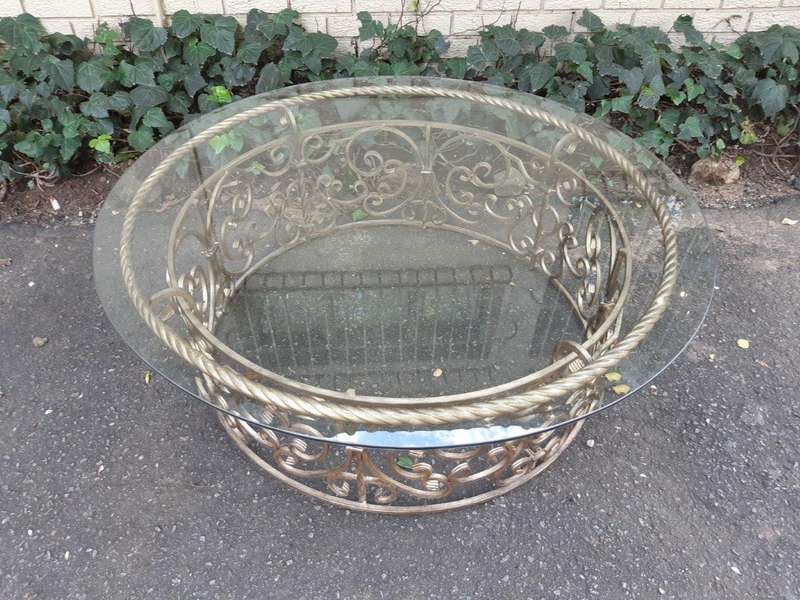 Round wrought iron coffee table with glass top with thick bevelled glass top