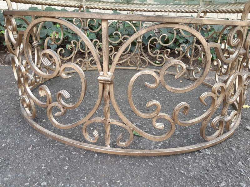 Round wrought iron coffee table with glass top with thick bevelled glass top