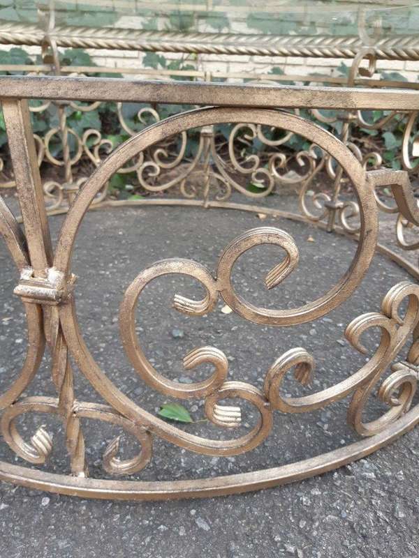 Round wrought iron coffee table with glass top with thick bevelled glass top