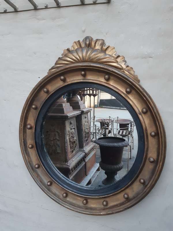 A Regency giltwood convex mirror