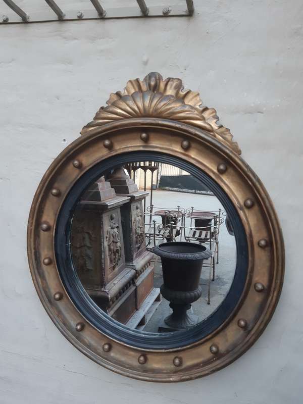 A Regency giltwood convex mirror