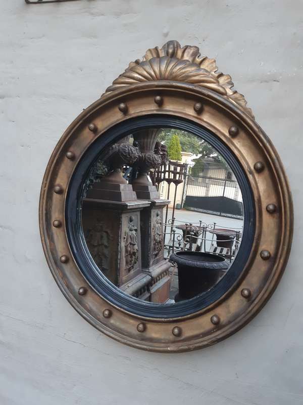 A Regency giltwood convex mirror