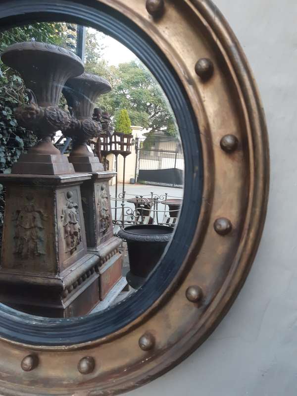 A Regency giltwood convex mirror