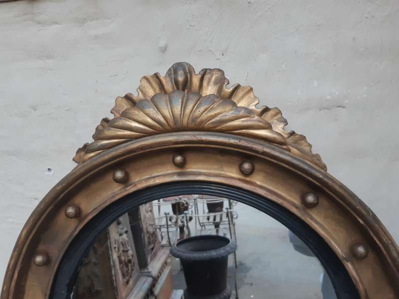A Regency giltwood convex mirror