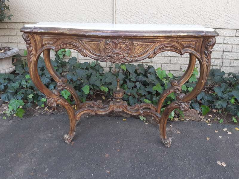A 19th century French giltwood and marble-topped console table