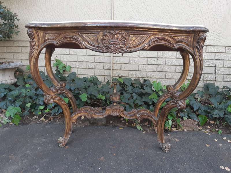 A 19th century French giltwood and marble-topped console table