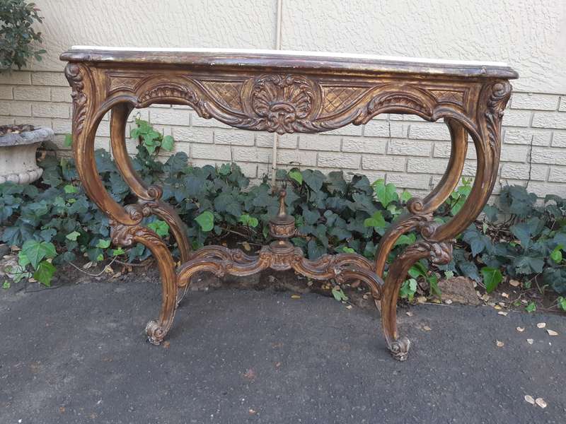 A 19th century French giltwood and marble-topped console table