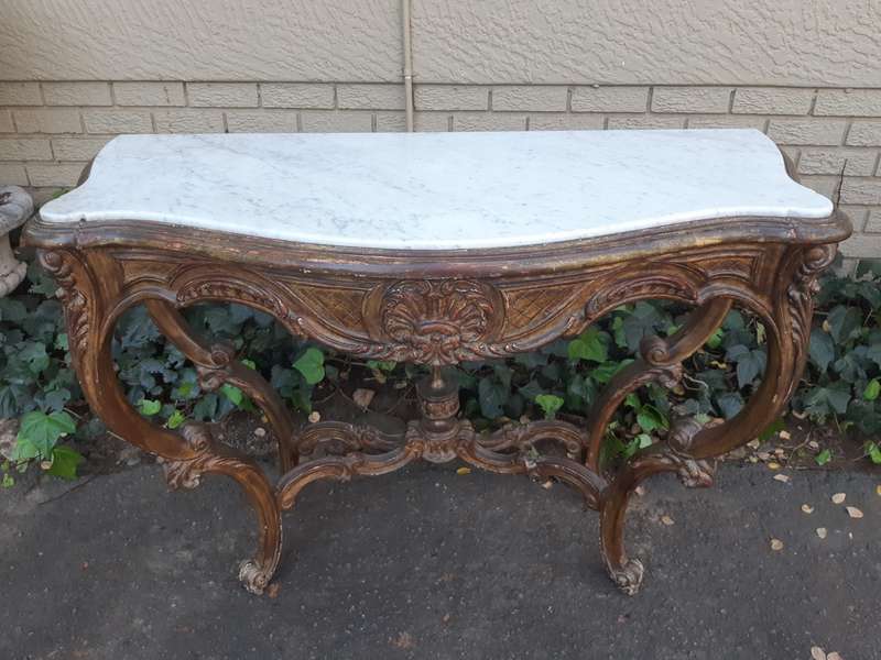 A 19th century French giltwood and marble-topped console table