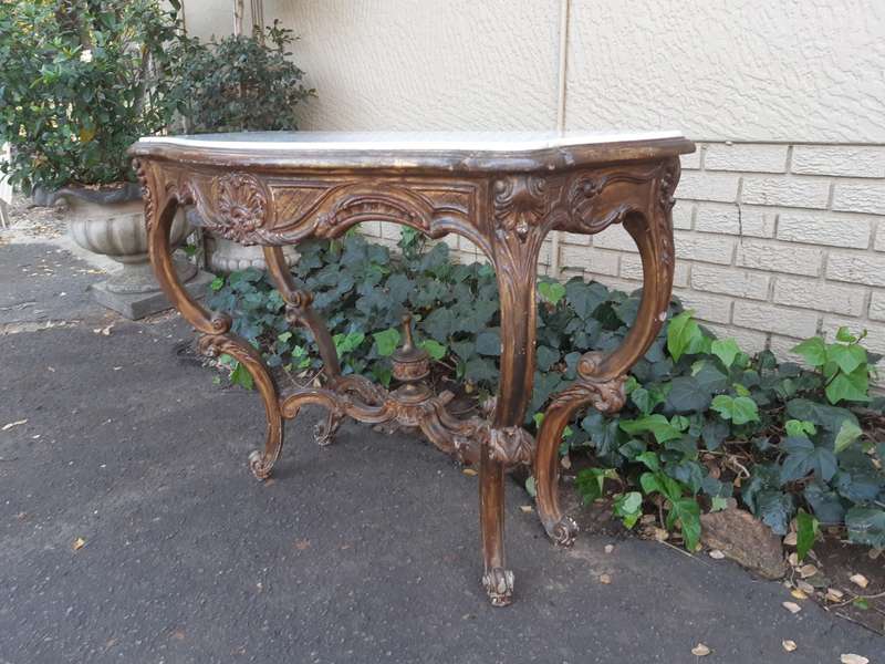 A 19th century French giltwood and marble-topped console table