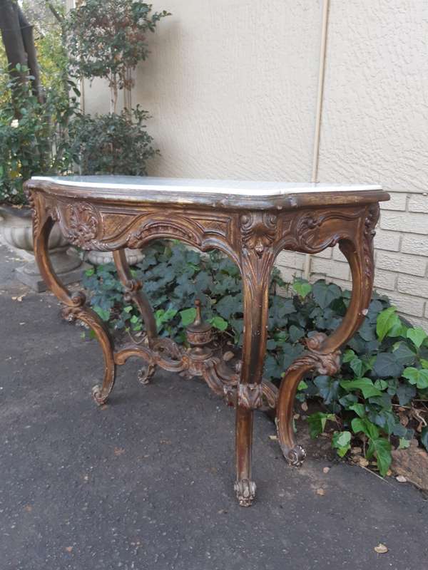 A 19th century French giltwood and marble-topped console table