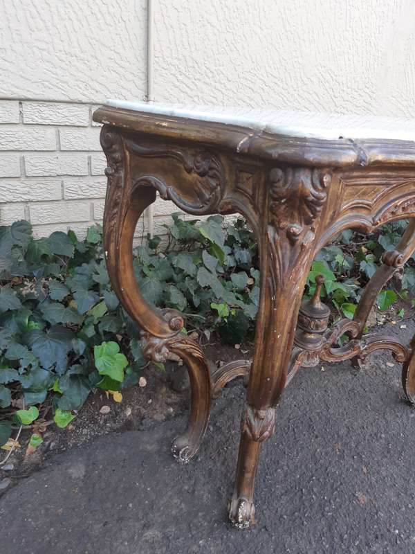 A 19th century French giltwood and marble-topped console table
