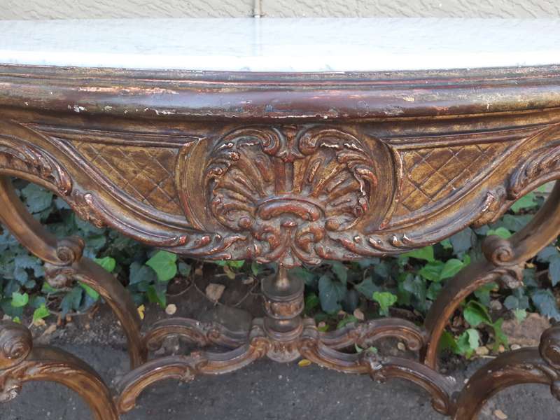 A 19th century French giltwood and marble-topped console table