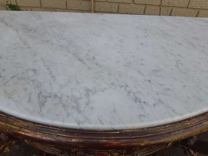 A 19th century French giltwood and marble-topped console table