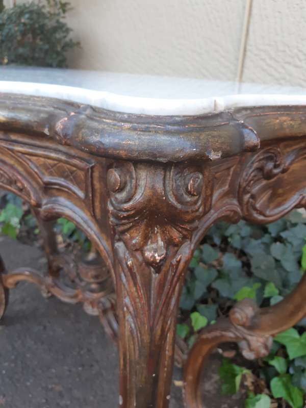A 19th century French giltwood and marble-topped console table