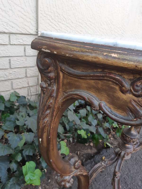 A 19th century French giltwood and marble-topped console table