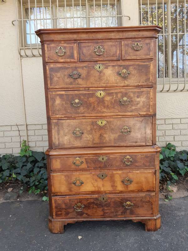 A NEAR PAIR of George III Burr walnut chest-on-chests