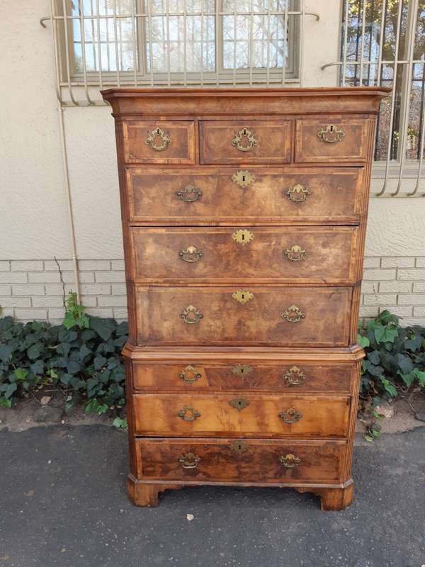 A NEAR PAIR of George III Burr walnut chest-on-chests