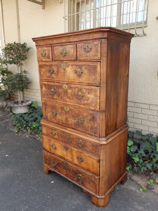 A NEAR PAIR of George III Burr walnut chest-on-chests