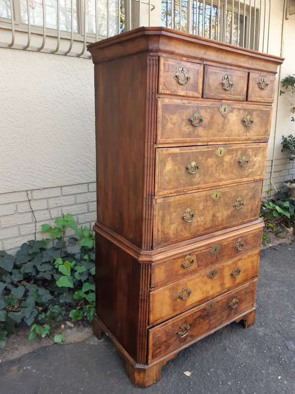 A NEAR PAIR of George III Burr walnut chest-on-chests