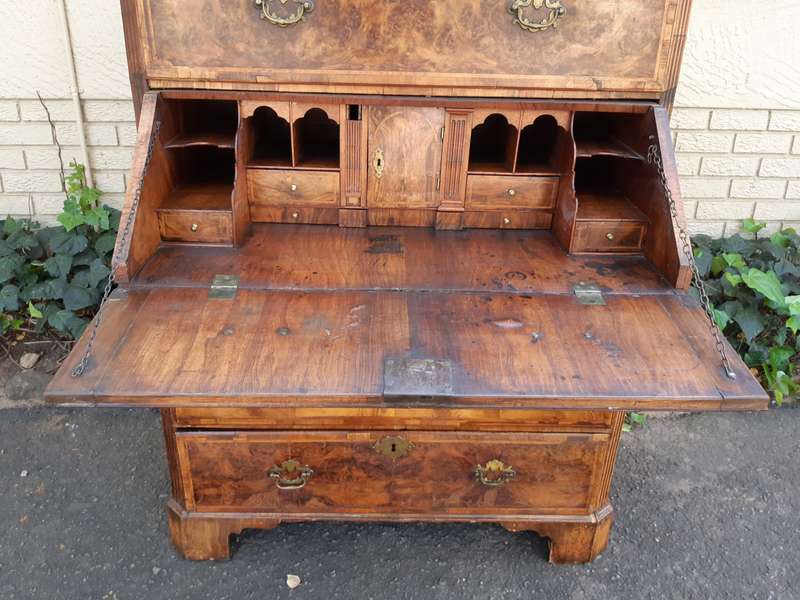 A NEAR PAIR of George III Burr walnut chest-on-chests