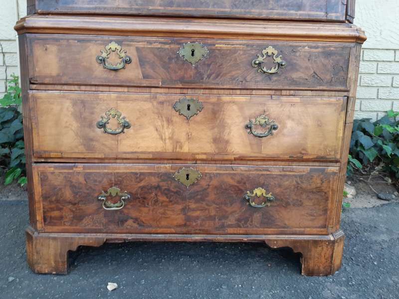 A NEAR PAIR of George III Burr walnut chest-on-chests