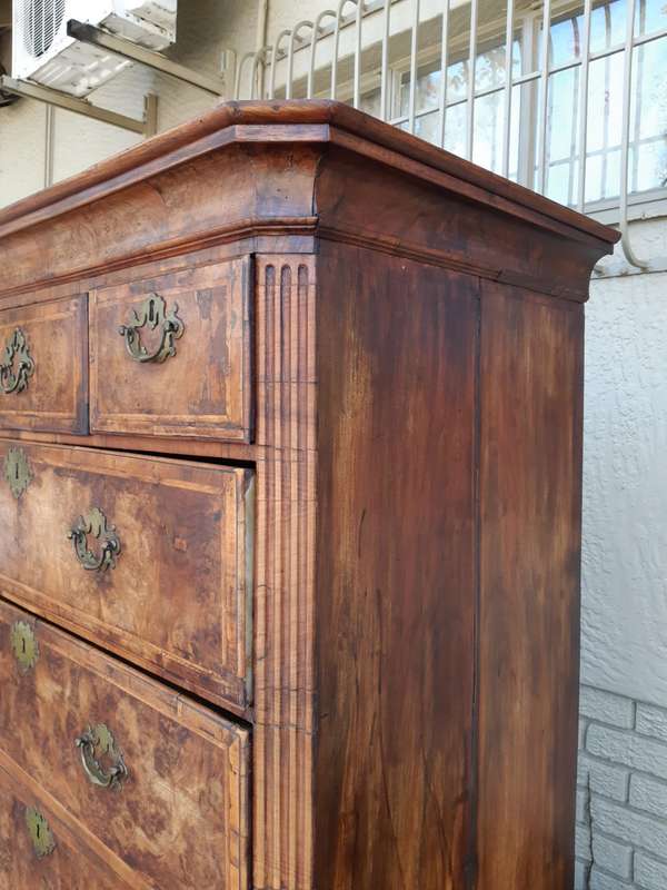 A NEAR PAIR of George III Burr walnut chest-on-chests