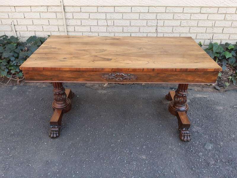 A William IV Rosewood Library Table With Brass Castors