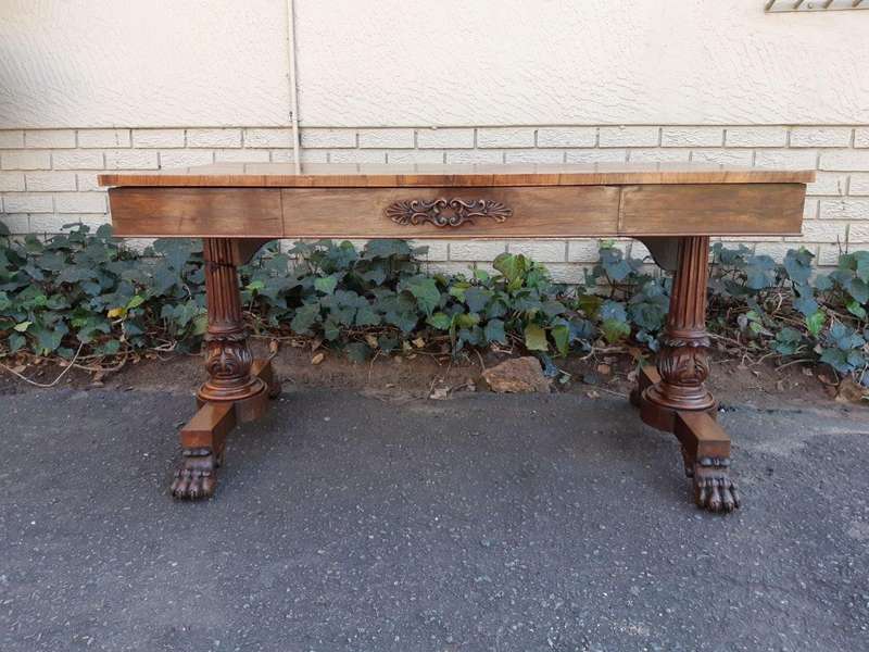 A William IV Rosewood Library Table With Brass Castors