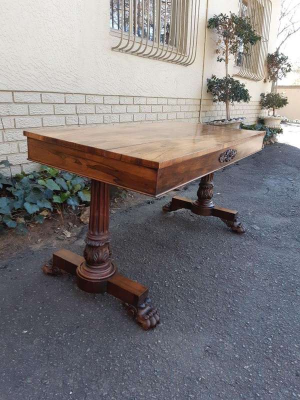 A William IV Rosewood Library Table With Brass Castors