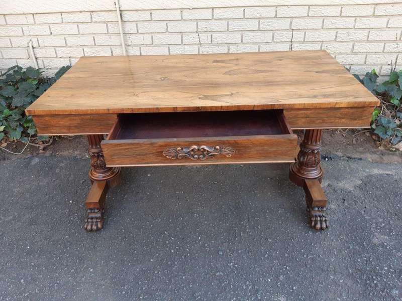 A William IV Rosewood Library Table With Brass Castors
