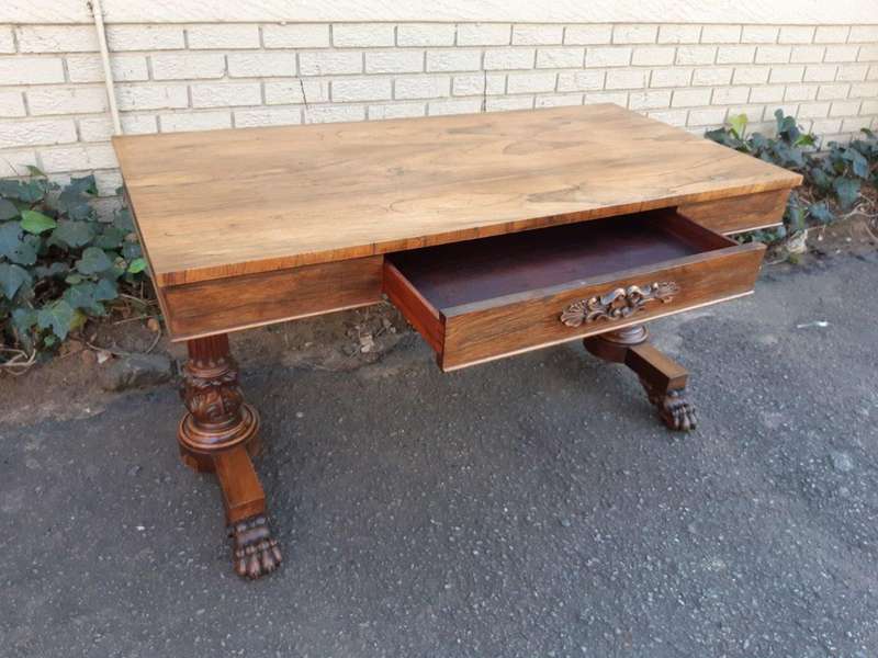 A William IV Rosewood Library Table With Brass Castors