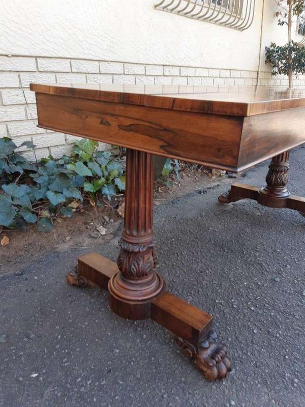 A William IV Rosewood Library Table With Brass Castors