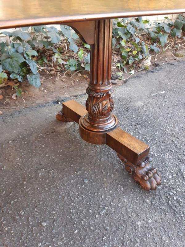 A William IV Rosewood Library Table With Brass Castors