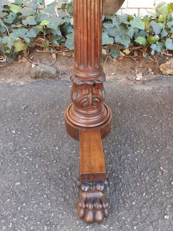 A William IV Rosewood Library Table With Brass Castors