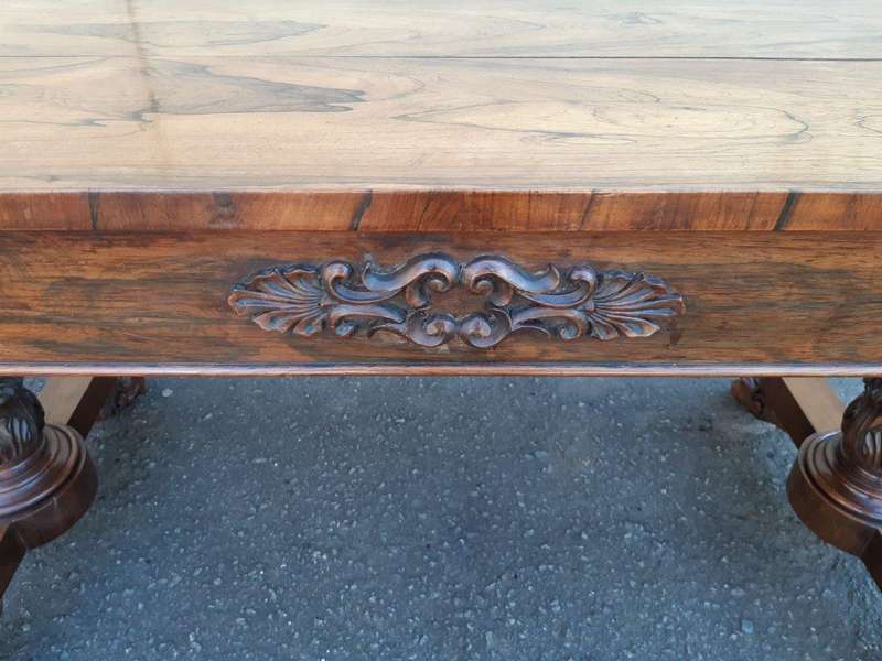 A William IV Rosewood Library Table With Brass Castors