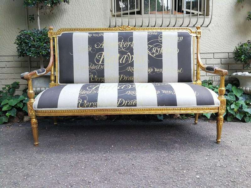 A 20th Century French Style Ornate Hand-Carved and Gilded Settee / Sofa Upholstered in a Custom-m...